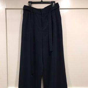 Uniqlo paper-bag, high-waisted wide-leg trouser.